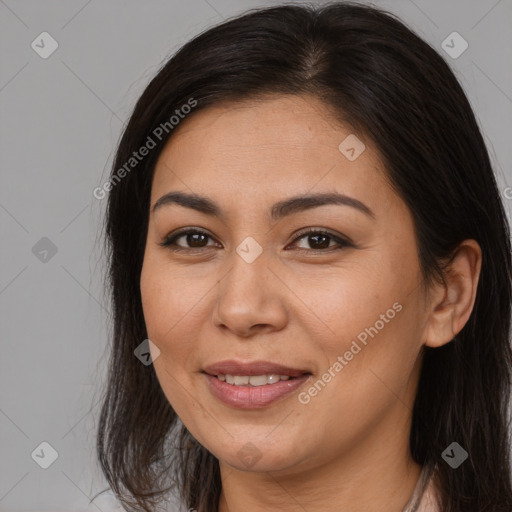 Joyful asian young-adult female with long  brown hair and brown eyes