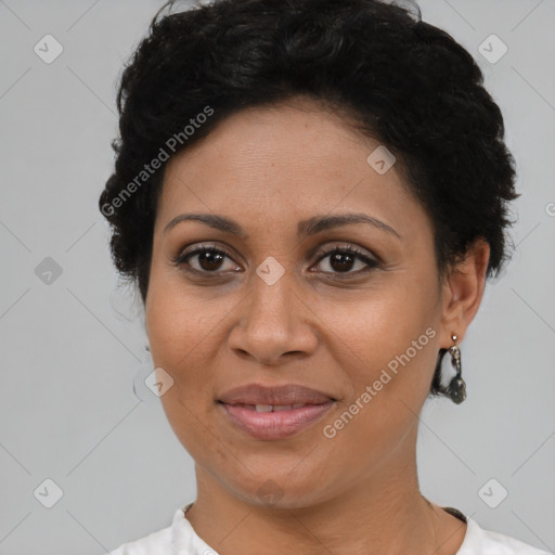 Joyful latino adult female with short  brown hair and brown eyes