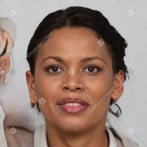 Joyful black adult female with short  brown hair and brown eyes