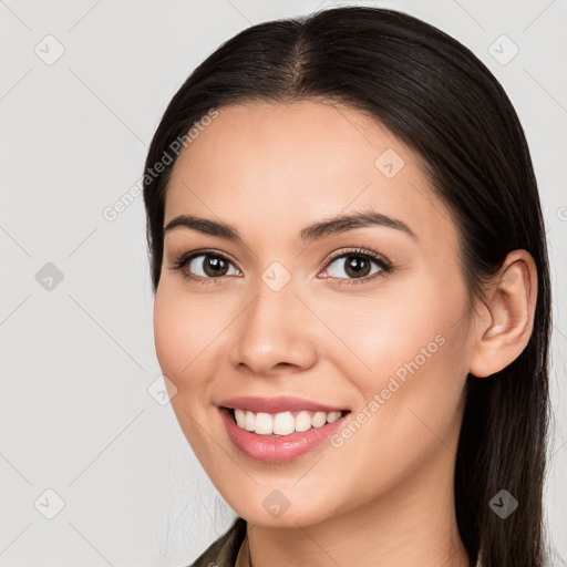 Joyful white young-adult female with long  brown hair and brown eyes