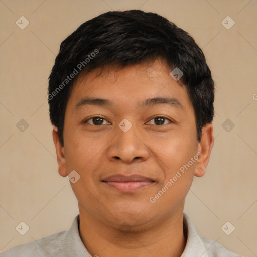 Joyful asian young-adult male with short  black hair and brown eyes