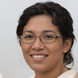 Joyful white adult female with medium  brown hair and brown eyes