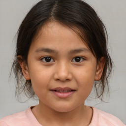 Joyful white child female with medium  brown hair and brown eyes