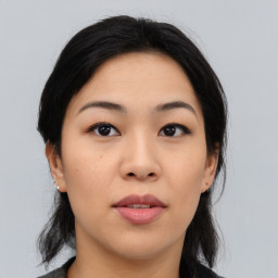 Joyful asian young-adult female with medium  black hair and brown eyes