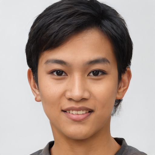 Joyful asian young-adult female with short  black hair and brown eyes