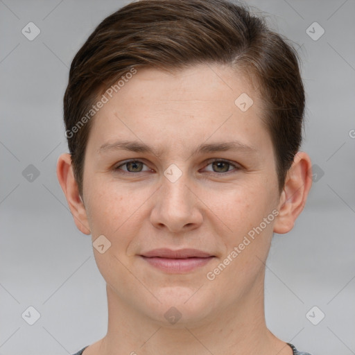 Joyful white young-adult female with short  brown hair and grey eyes