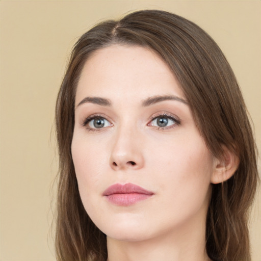 Neutral white young-adult female with long  brown hair and green eyes