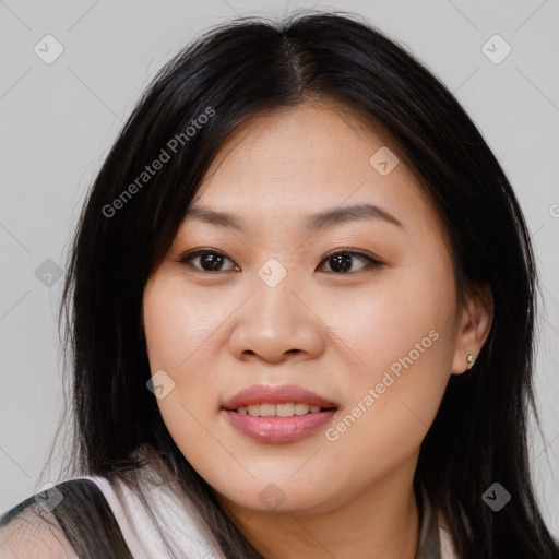 Joyful asian young-adult female with long  brown hair and brown eyes