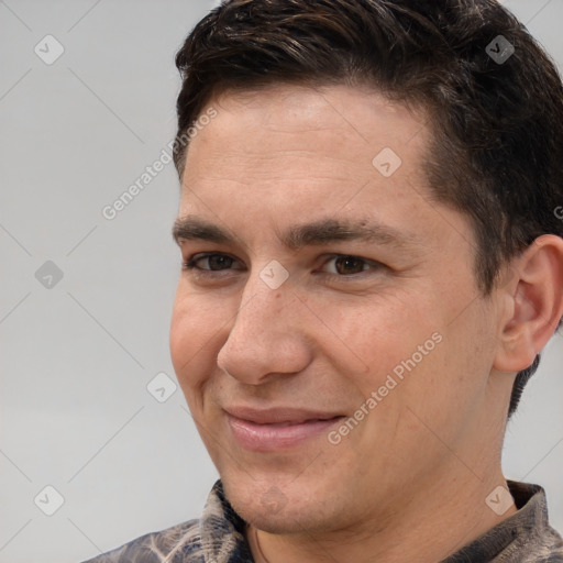 Joyful white young-adult male with short  brown hair and brown eyes