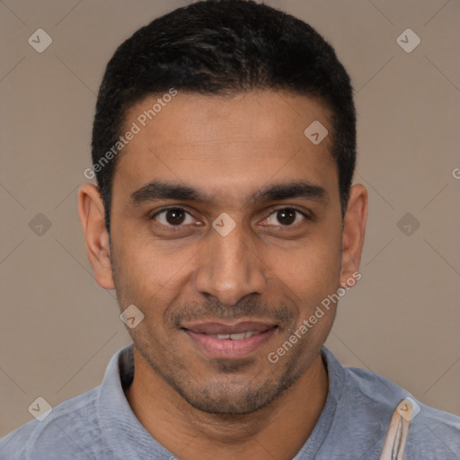 Joyful latino young-adult male with short  black hair and brown eyes