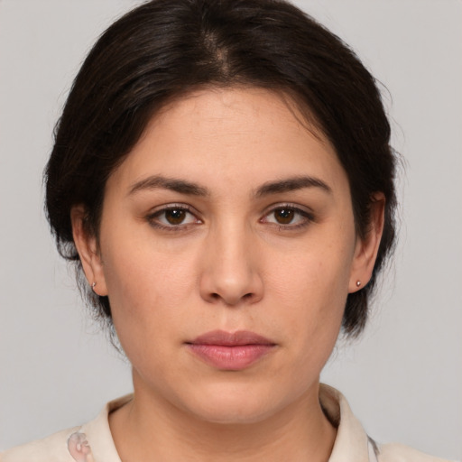 Joyful white young-adult female with medium  brown hair and brown eyes