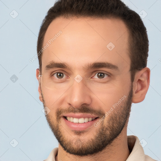 Joyful white young-adult male with short  brown hair and brown eyes