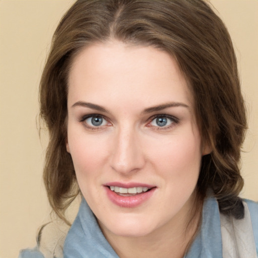 Joyful white young-adult female with medium  brown hair and blue eyes