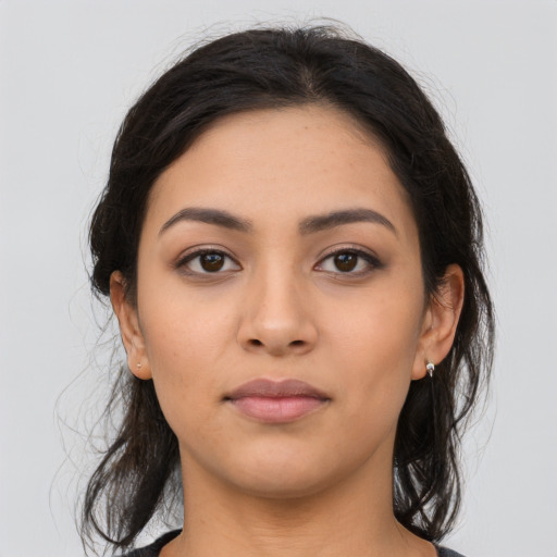 Neutral latino young-adult female with medium  brown hair and brown eyes