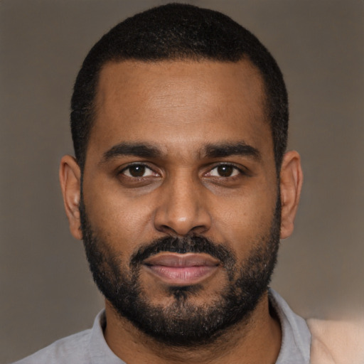 Neutral black young-adult male with short  black hair and brown eyes