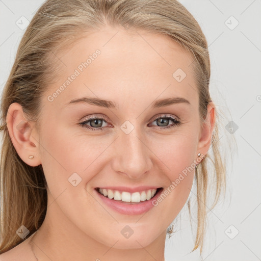 Joyful white young-adult female with long  brown hair and blue eyes