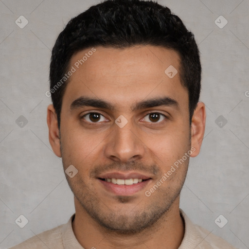 Joyful white young-adult male with short  black hair and brown eyes