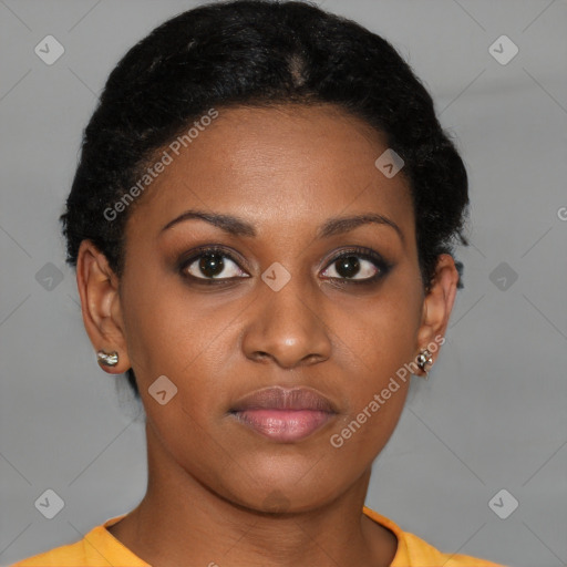 Joyful black young-adult female with short  brown hair and brown eyes