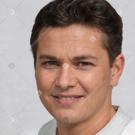 Joyful white adult male with short  brown hair and brown eyes