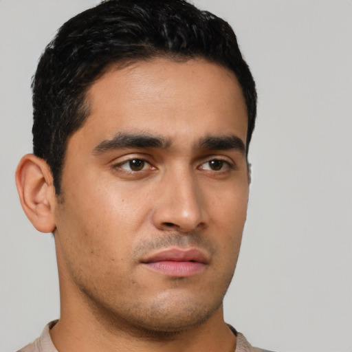 Neutral latino young-adult male with short  black hair and brown eyes