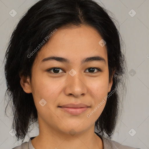 Joyful latino young-adult female with medium  brown hair and brown eyes