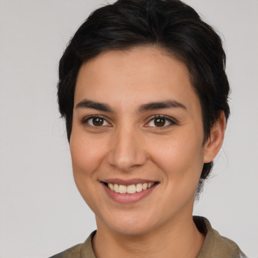 Joyful white young-adult female with medium  brown hair and brown eyes