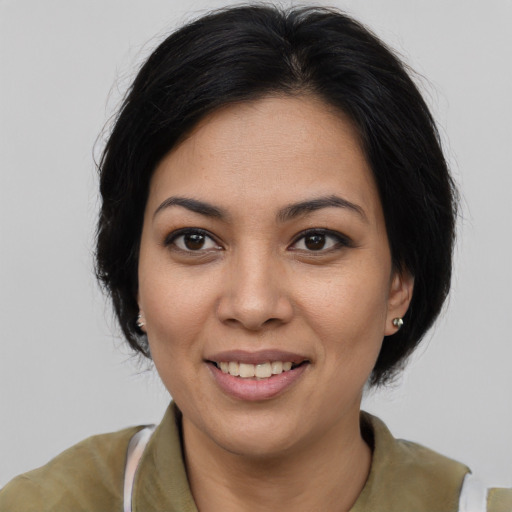 Joyful asian young-adult female with medium  black hair and brown eyes