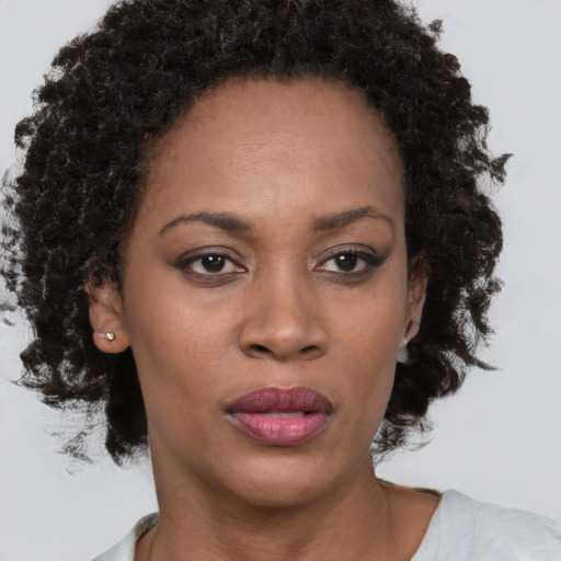 Neutral black adult female with short  brown hair and brown eyes