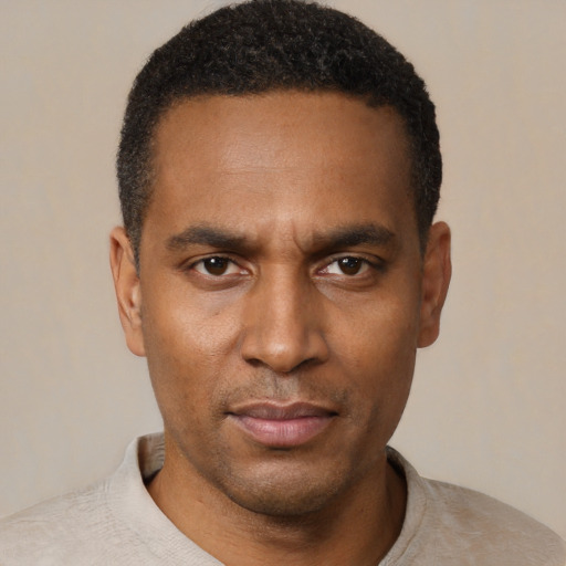 Neutral black young-adult male with short  black hair and brown eyes