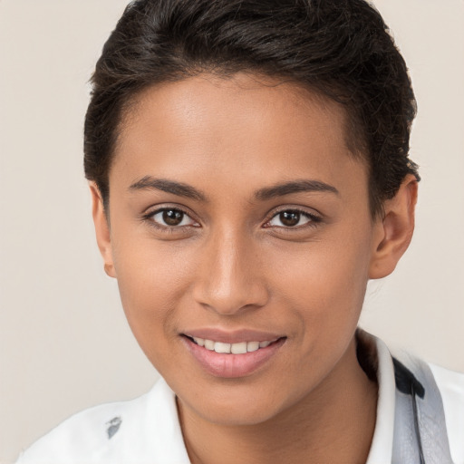 Joyful white young-adult female with short  brown hair and brown eyes