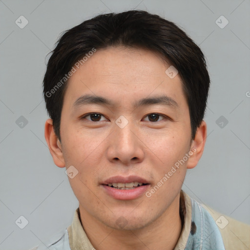 Joyful asian young-adult male with short  brown hair and brown eyes