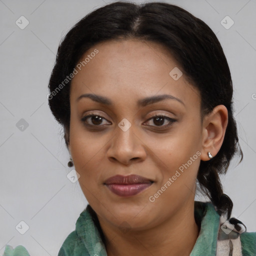Joyful black young-adult female with medium  black hair and brown eyes