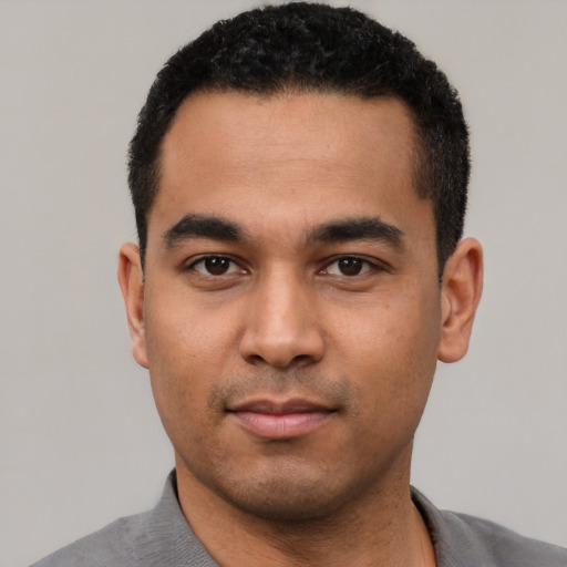 Neutral latino young-adult male with short  black hair and brown eyes