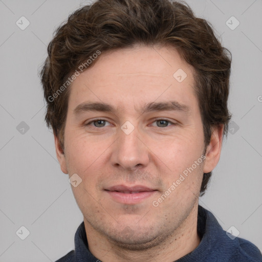 Joyful white adult male with short  brown hair and grey eyes