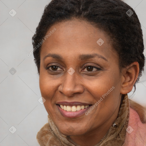 Joyful black adult female with short  brown hair and brown eyes