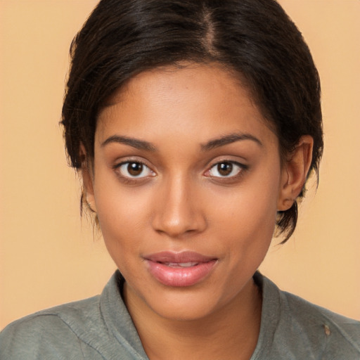 Joyful latino young-adult female with medium  brown hair and brown eyes