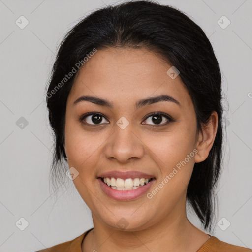 Joyful latino young-adult female with medium  brown hair and brown eyes