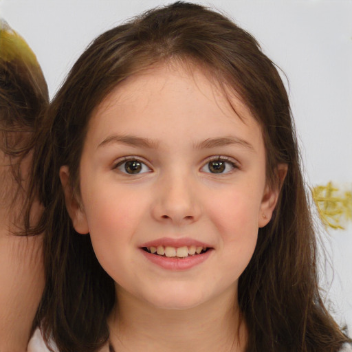 Joyful white child female with medium  brown hair and brown eyes