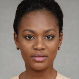 Neutral black young-adult female with short  brown hair and brown eyes