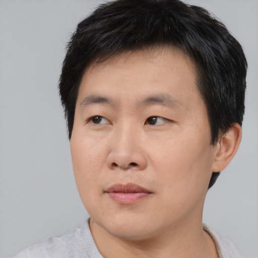 Neutral asian young-adult male with short  brown hair and brown eyes