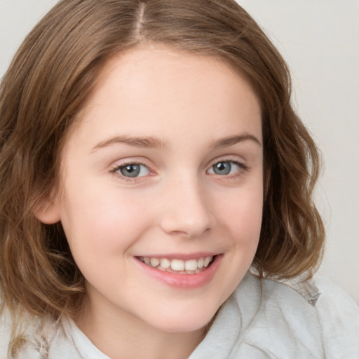 Joyful white child female with medium  brown hair and brown eyes