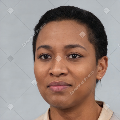 Joyful black young-adult female with short  black hair and brown eyes