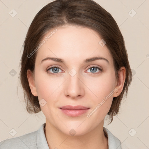 Joyful white young-adult female with medium  brown hair and grey eyes