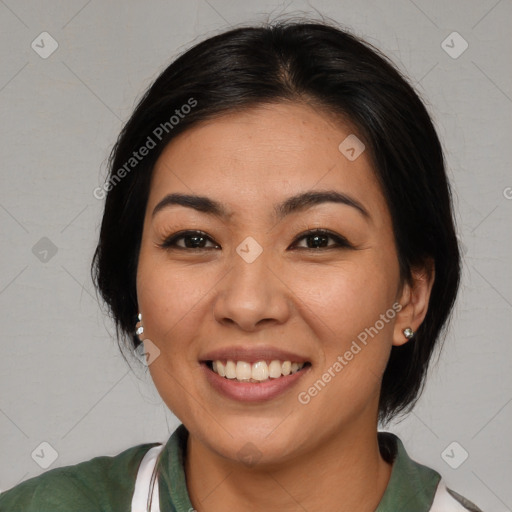 Joyful asian young-adult female with medium  brown hair and brown eyes