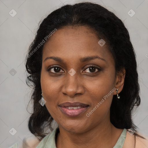 Joyful black adult female with medium  brown hair and brown eyes