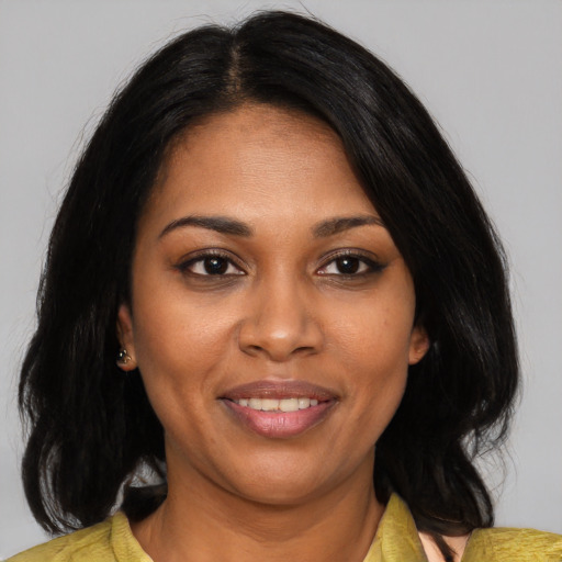Joyful black young-adult female with medium  black hair and brown eyes