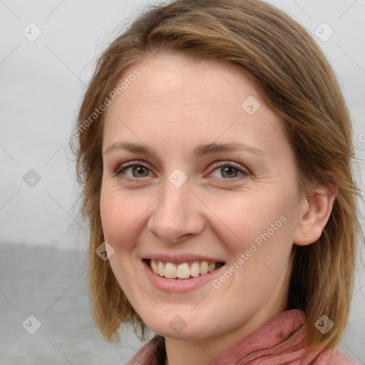 Joyful white young-adult female with long  brown hair and blue eyes