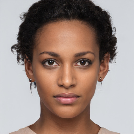 Neutral black young-adult female with short  brown hair and brown eyes