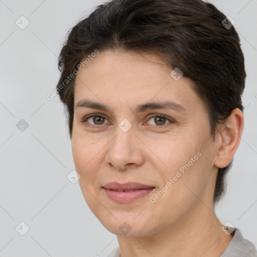 Joyful white adult female with short  brown hair and brown eyes