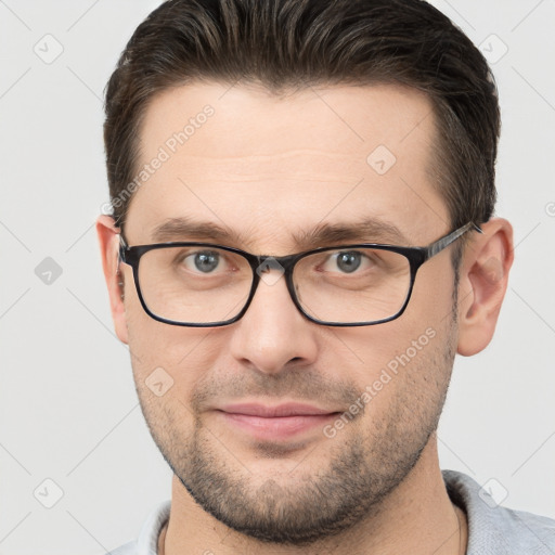 Joyful white young-adult male with short  brown hair and brown eyes